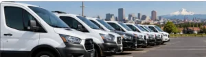 Professional fleet detailing service cleaning commercial vehicles at a Portland business.