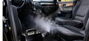 Cleaning a car interior to remove gasoline odors from carpet and upholstery.