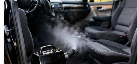 Cleaning a car interior to remove gasoline odors from carpet and upholstery.